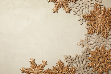 Composition with beautiful snowflakes and space for text on color background, top view. Festive winter design