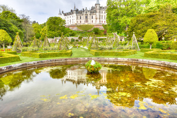 Scenic Dunrobin Castle lake with the Dunrobin castle reflecting. Garden park in Scottish Highlands, Scotland, United Kingdom.