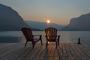 Fototapeta na wymiar Smoky Sunrise at Lake Minnewanka in Banff National Park