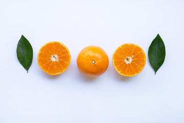 Fresh orange citrus fruit with leaves isolated on white background.  Top view