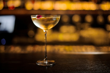 Delicious Twinkle cocktail decorated with red berry