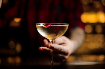 Bartender serving a cocktail Twinkle in the bar