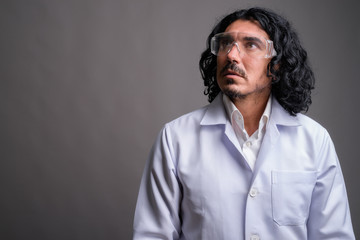 Scientist man doctor with mustache wearing protective glasses