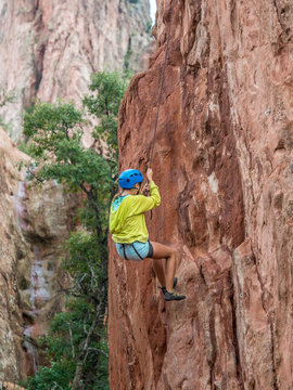 A girl doing rock climbing