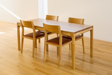 a four-person wooden table and chair