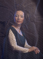 woman with long hair in historical medieval green dress