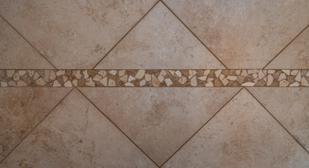 Large tile and small stones in the shower