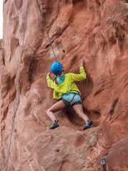 A girl doing rock climbing