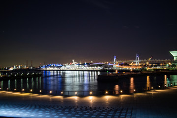A nightscape of Yokoham bay with the Yokohama Bay Bridge in the distance