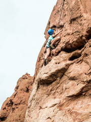 A girl doing rock climbing