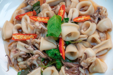 Fried basil leave with squid Thai food.