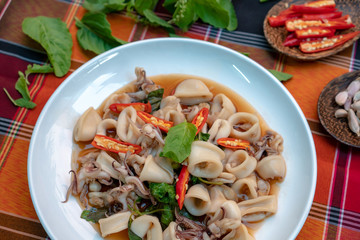 Fried basil leave with squid thai food.