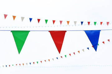 Vintage style Colorful flags on white sky.