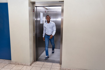 Man Coming Out From An Elevator