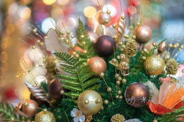 Fototapeta na wymiar Christmas decorative basket with pine leaves, pine fruit, balls, golden flowers....