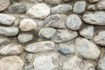 Old stone wall texture background close up