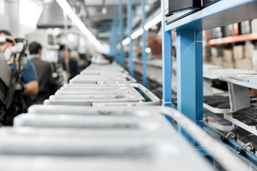 The conveyor on a shoes factory with shoe and sole. Mass production of footwear.