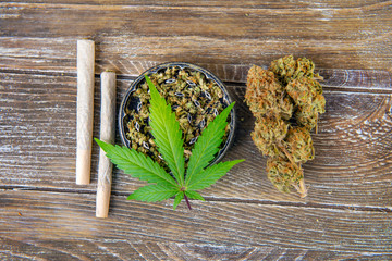 Cannabis joints with fresh nugs and grinder