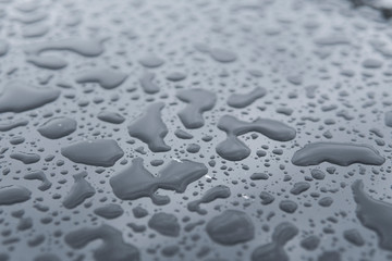 Natural water drops on a glass table after rain.