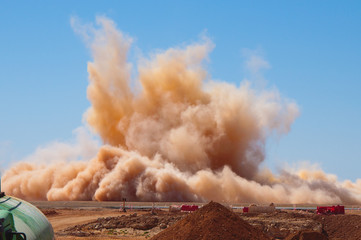 Dust clouds after blasting on the site