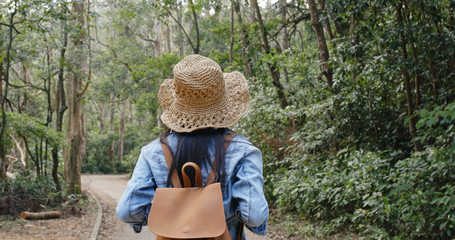 Woman go hiking in the forest