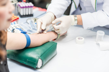 Blood sample from a vein, Nurse taking Real Blood samples analysis from a vein of the patient,...