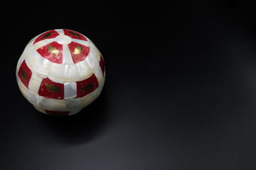 White and red christmas bauble. Right copy space.