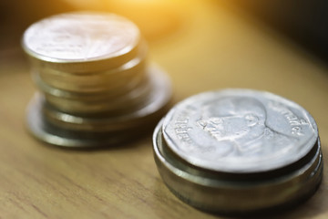 Thai Baht coin on wooden table finance wealth Business