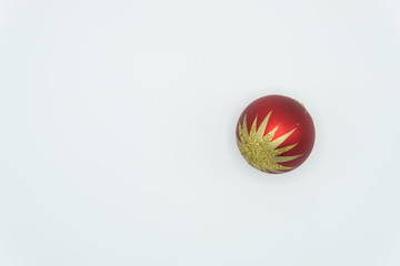 Red and shiny golden christmas ball.