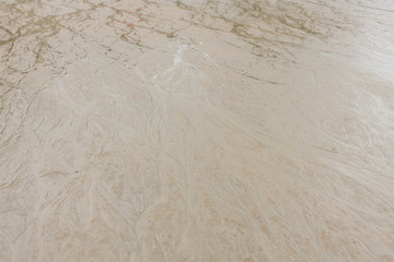 Hintergrundbild eines Sandstrands bei Ebbe