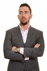 Young handsome Caucasian businessman thinking and planning