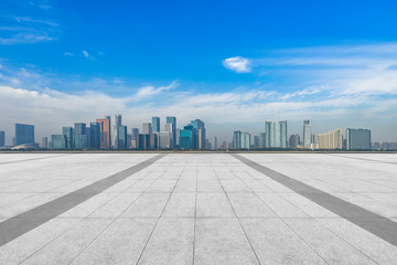 Panoramic skyline and buildings with empty square floor.