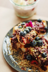 Waffle with fruits in a cafe closeup