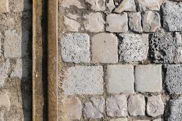 Old unused train tracks on cobble stone
