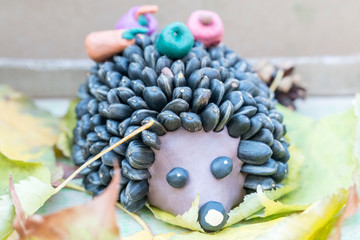 Children crafts - hedgehog from clay and seeds