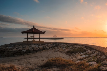 Fototapeta na wymiar Bali pavilion on jetty at coastline in morning