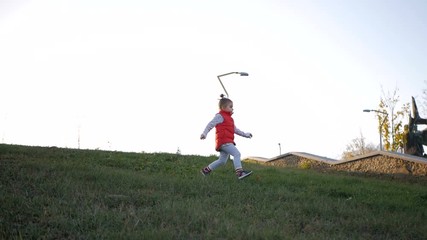 Happy family launching toy plane in park