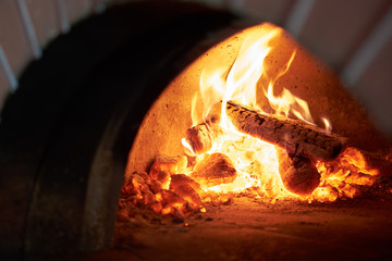 fireplace in the brick oven in pizzeria - obrazy, fototapety, plakaty