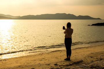 silhouette of people at the beach Beach activities The beauty of natural light at sunset.