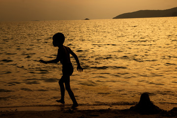 silhouette of people at the beach Beach activities The beauty of natural light at sunset.