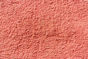 Rough red decorative facade plasters texture.