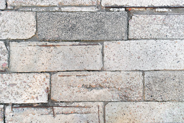 Old concrete plates with potholes and pieces of reinforcement