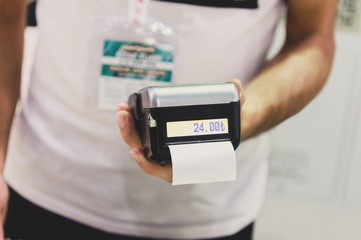 Man with POS machine getting ready to for the payment