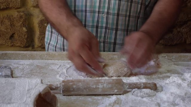 Man preparing delicious Halawet Rez dessert in Tripoli, Nouh