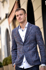 Urban stile young man wearing blue jacket.