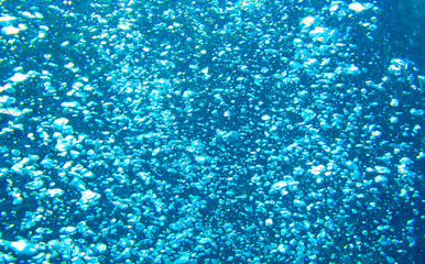 Seawater bubbles background. Sea water bubbles view from undewater. Oxygen in seawater. Condensator aeration bubbles.