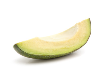 Slice of avocado isolated