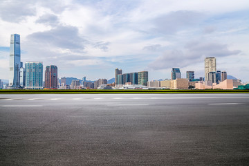Panoramic skyline and modern business office buildings with empty road,empty concrete square floor - obrazy, fototapety, plakaty