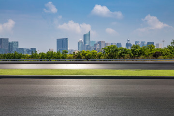 Panoramic skyline and modern business office buildings with empty road,empty concrete square floor