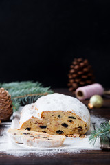 Christmas stollen cake with icing sugar. Traditional Dresdner christ pastry. Copy space.